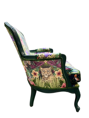 Exotica velvet by Victoria Sanders in black, jungle animals and tropical flowers on an upholstered chair