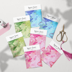 Amalfi Eco Velvet velvet by Liberty James Studio in blue and pink, sample swatch cards showing a marbled kaleidoscope design