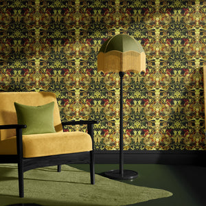 Gilded Wine wallpaper by Liberty James Studio in gold, green and red, an ornate mirrored design in a living room