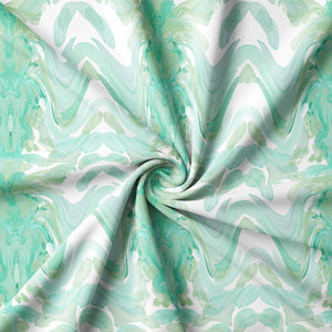 Bel Air Blossom Eco velvet by Liberty James Studio in mint green, in soft folds showing a mirrored blossom design