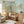 Reve D’Enfant wallpaper by Claire de Quénetain in green and orange, full repeat of a hand-painted floral design