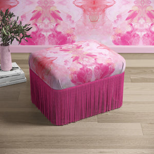 Amalfi Eco Velvet velvet by Liberty James Studio in pink, a marbled kaleidoscope design on an upholstered ottoman