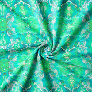 Naples velvet by Liberty James Studio in turquoise, draped close-up of an ornate kaleidoscope design