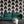 Empress Fan wallpaper by Liberty James Studio in black, art deco fan leaves on a living room wall