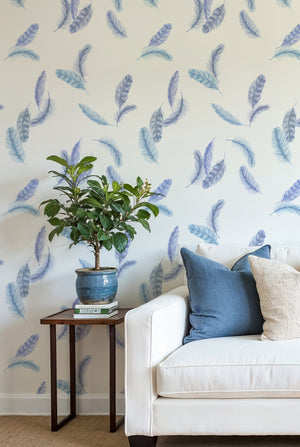 Newtown Creek wallpaper by XV Interiors in blue, drifting feathers on a living room wall