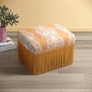 Bel Air Blossom Eco velvet by Liberty James Studio in apricot, a mirrored blossom design upholstered on a fringed footstool