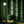 Emerald Elixir wallpaper by Liberty James Studio in black and green, mirrored art deco motifs in a living room