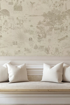 Dog Tales wallpaper by Victoria Sanders in cream, a toile of dogs in the countryside in a living room