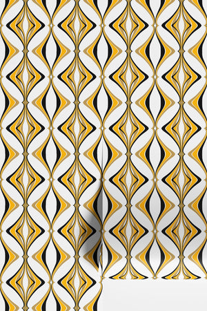 Hourglass wallpaper by Liberty James Studio in yellow and black, partly unrolled roll showing a retro hourglass wave