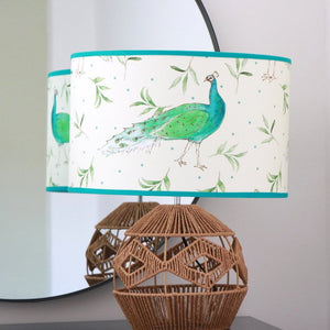 Peacock and Olive in Antique Cream fabric by Seed Home Designs in cream, peacocks and olive sprigs in a styled room setting