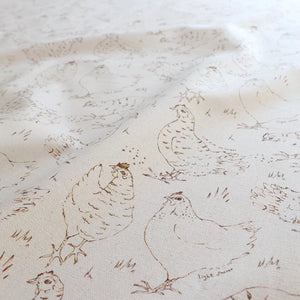 Natural Organic Hens linen by Seed Home Designs in beige, in soft folds showing line-drawn hens