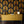 Empress Fan wallpaper by Liberty James Studio in gold, art deco fan leaves above a sideboard