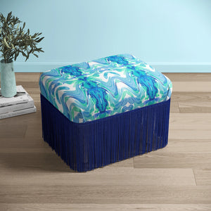Bel Air Blossom Eco velvet by Liberty James Studio in blue, a mirrored blossom design upholstered on a fringed footstool