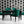 Empress Fan wallpaper by Liberty James Studio in black, art deco fan leaves in a dining area