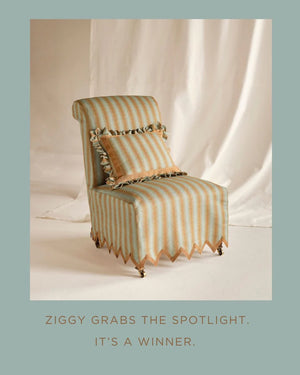 Ziggy linen by Parker and Jules in aqua and terracotta, a chevron zigzag weave on an upholstered chair