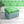 Psychedelic Pop Eco velvet by Liberty James Studio in green upholstered on a fringed footstool
