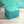 Naples velvet by Liberty James Studio in turquoise, an ornate kaleidoscope design covering a footstool
