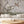 Birdsong By the Lake wallpaper by Dami and Em Design in pink, birds and blossom by a lake in a living room