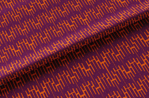 Structured Chaos linen by Dami and Em Design in purple, draped, showing a geometric design