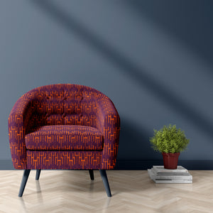 Structured Chaos linen by Dami and Em Design in purple, a geometric design upholstered on an armchair