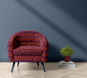 Structured Chaos linen by Dami and Em Design in purple, a geometric design upholstered on an armchair