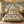 Stripe Weave linen by Dami and Em Design in terracotta, woven stripes behind a bed