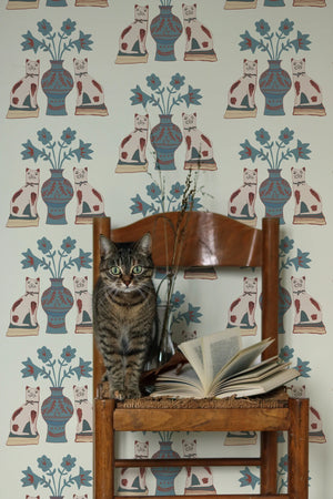 Pair of Cats wallpaper by Annika Reed in blue and cream, pairs of cats and vases in a living room