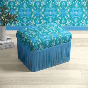 Naples velvet by Liberty James Studio in pink, an ornate kaleidoscope design upholstered on a fringed footstool