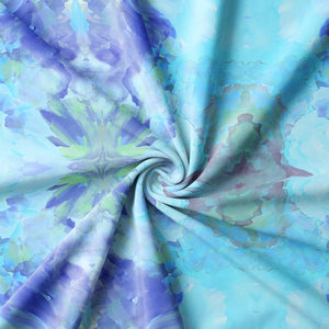 Amalfi Eco Velvet velvet by Liberty James Studio in blue and pink, draped, showing a marbled kaleidoscope design