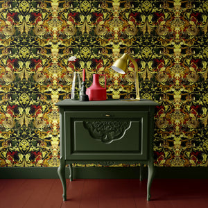 Gilded Wine wallpaper by Liberty James Studio in gold, green and red, an ornate mirrored design above a sideboard