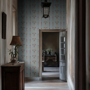 Angels and Suns wallpaper by Tatie Lou in grey, cherubs and suns in trails in a hallway