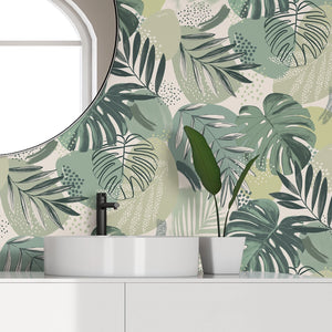 Abstract Jungle wallpaper by Brand McKenzie in green, oversized monstera and palm leaves on a bathroom wall