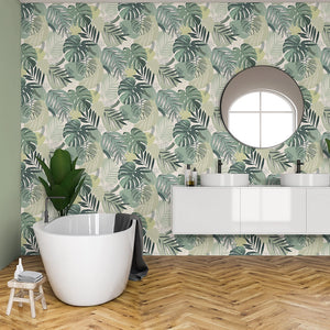Abstract Jungle wallpaper by Brand McKenzie in green, oversized monstera and palm leaves in a bathroom