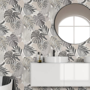 Abstract Jungle wallpaper by Brand McKenzie in grey, oversized monstera and palm leaves in a bathroom setting
