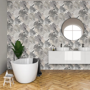 Abstract Jungle wallpaper by Brand McKenzie in grey, oversized monstera and palm leaves on a bathroom wall