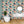 Abstract Jungle wallpaper by Brand McKenzie in coral and teal, oversized monstera and palm leaves in a bathroom