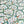 Albane linen by Claire de Quénetain in green and blue, full repeat of a hand-painted floral design