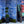 All Tomorrow’s Future linen by The Monkey Puzzle Tree in blue, a dense folk-art scene in a styled room setting