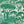 All Tomorrow’s Future linen by The Monkey Puzzle Tree in green, full repeat of a dense folk-art scene
