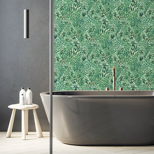 Alpine Landscape wallpaper by Brand McKenzie in green, dense alpine foliage on a bathroom wall