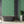 Alpine Landscape wallpaper by Brand McKenzie in green, dense alpine foliage in a bathroom