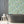 Alpine Landscape wallpaper by Brand McKenzie in green, dense alpine foliage in a bathroom setting
