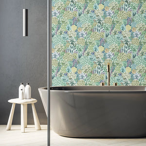 Alpine Landscape wallpaper by Brand McKenzie in green, dense alpine foliage in a bathroom setting
