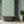 Alpine Landscape wallpaper by Brand McKenzie in sage green and lilac, dense alpine foliage in a bathroom