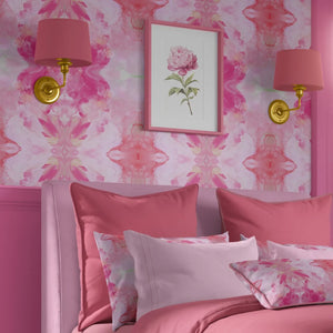 Amalfi wallpaper by Liberty James Studio in pink, a marbled kaleidoscope design in a bedroom