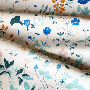 Ambre linen by Claire de Quénetain in pink and green, draped, showing a hand-painted floral design