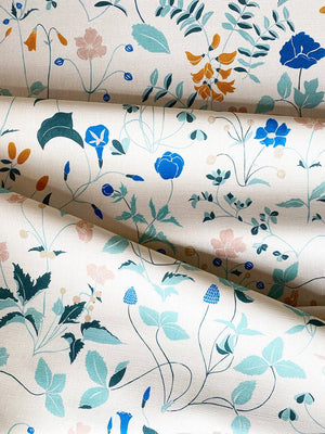 Ambre linen by Claire de Quénetain in pink and green, draped, showing a hand-painted floral design