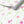 Anemone in Bloom wallpaper by Seed Home Designs in pink and green, partly unrolled roll showing watercolour anemone flowers