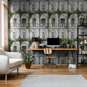 Animal Architecture wallpaper by Brand McKenzie in green behind a desk in a home office