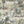 Animal Islands wallpaper by Brand McKenzie in cream and green, detail of palm-filled islands and wildlife